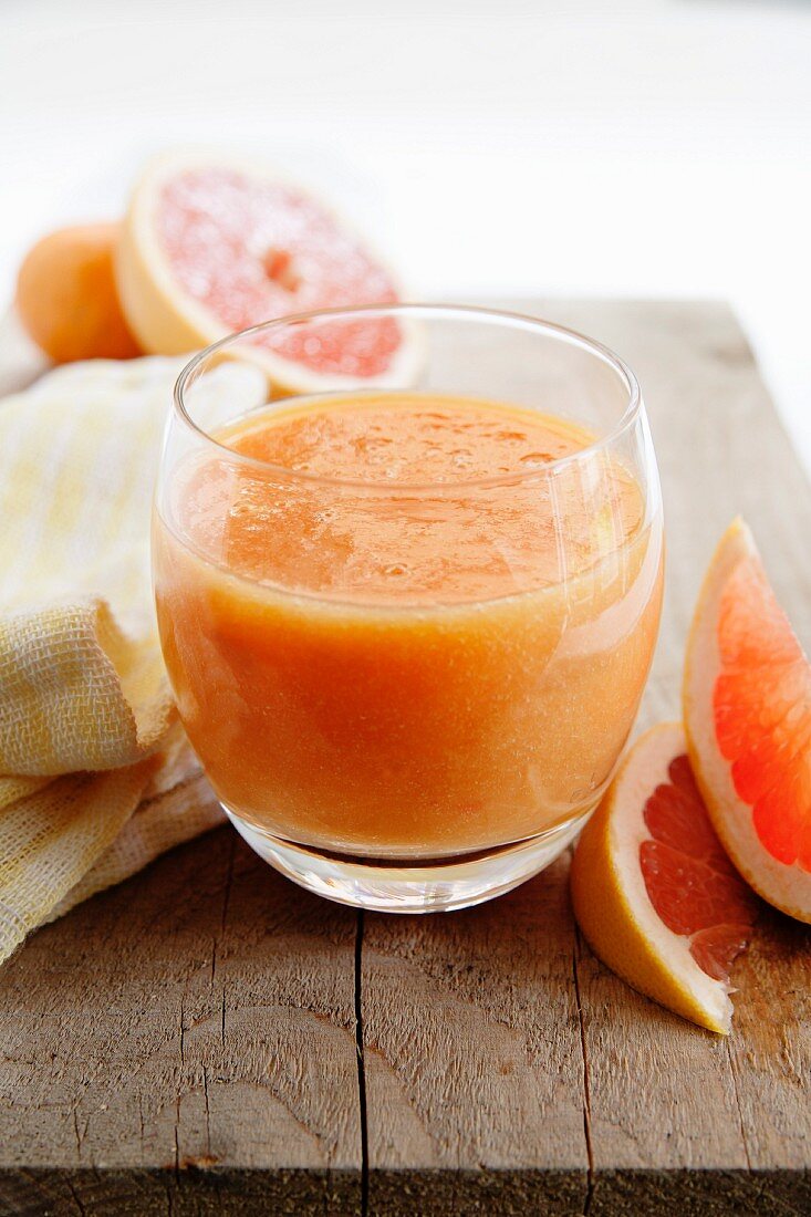 A glass of pink grapefruit and orange juice