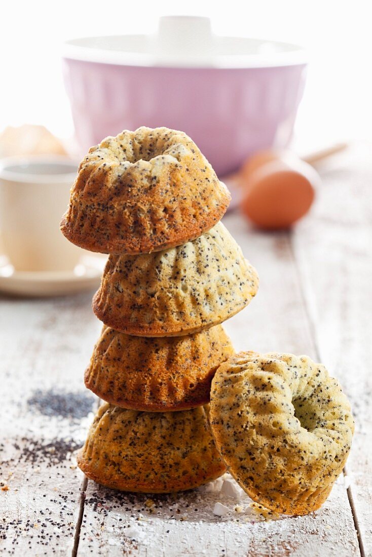A stack of mini Bundt cakes with poppy seeds