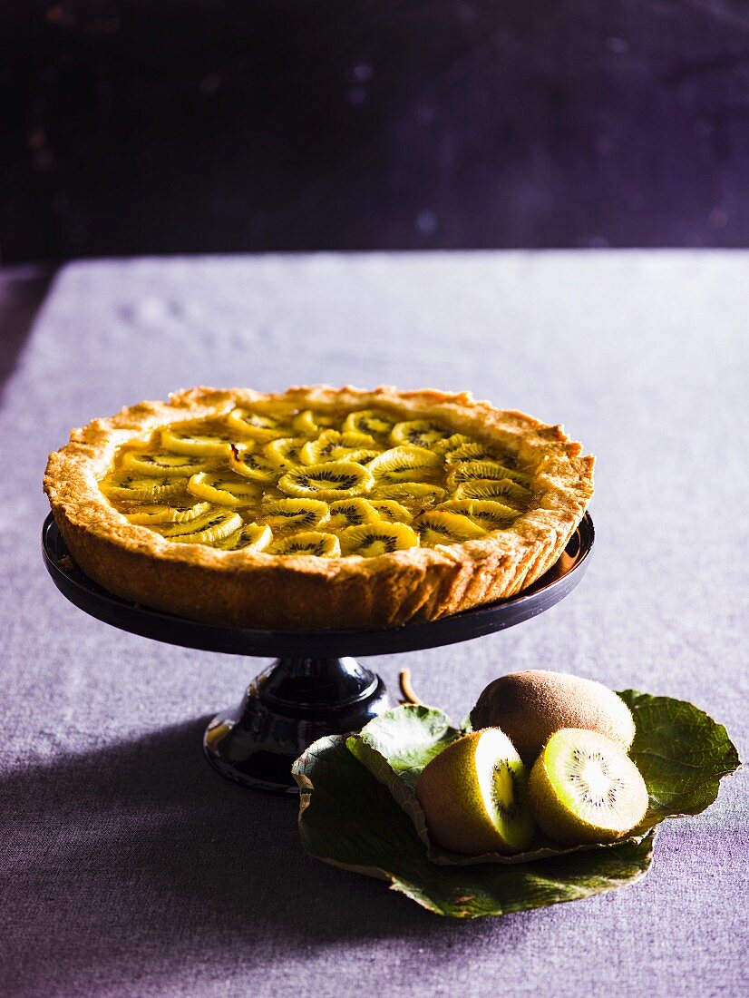 Kiwi pie on a cake stand