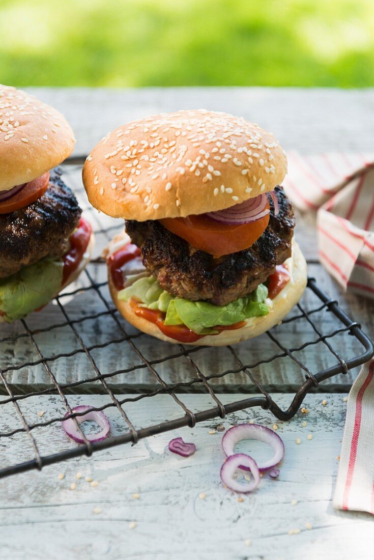 Grilled hamburgers on a garden table