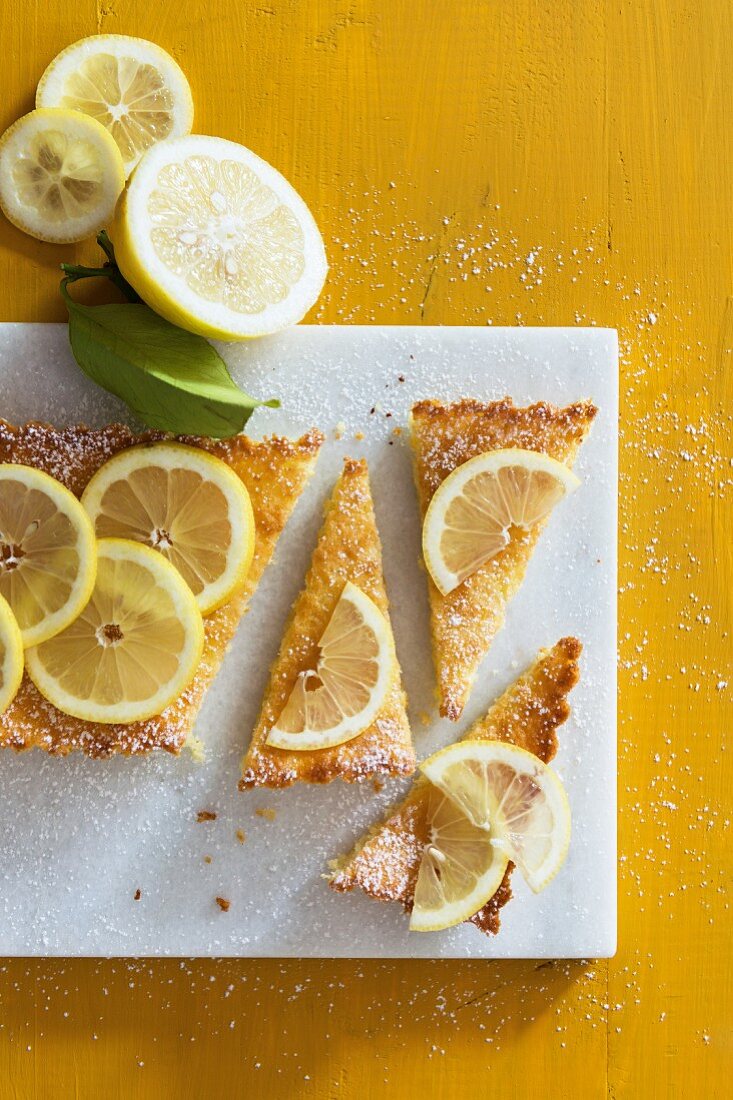 Lemon pie, sliced, with lemon slices