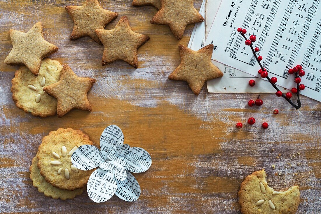 Various different Christmas biscuits and sheet music