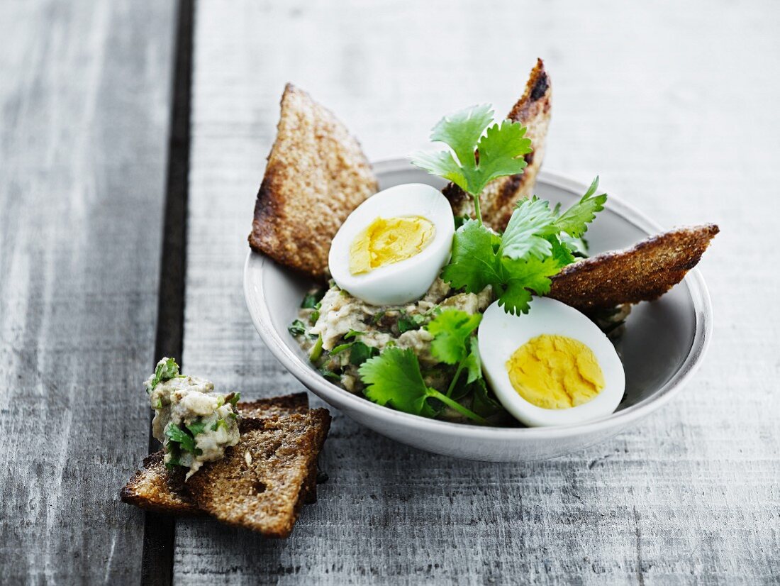 Aubergine salad with egg and grilled bread