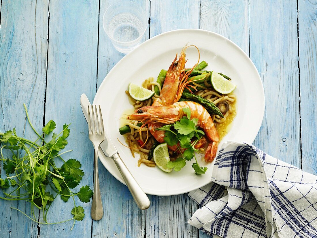 King prawns with coriander and lime on a bed of udon noodles