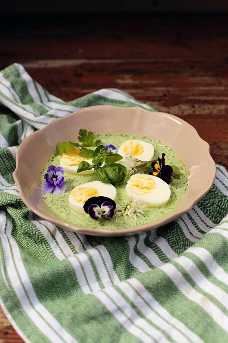 Eggs in Frankfurt green sauce garnished with flowers