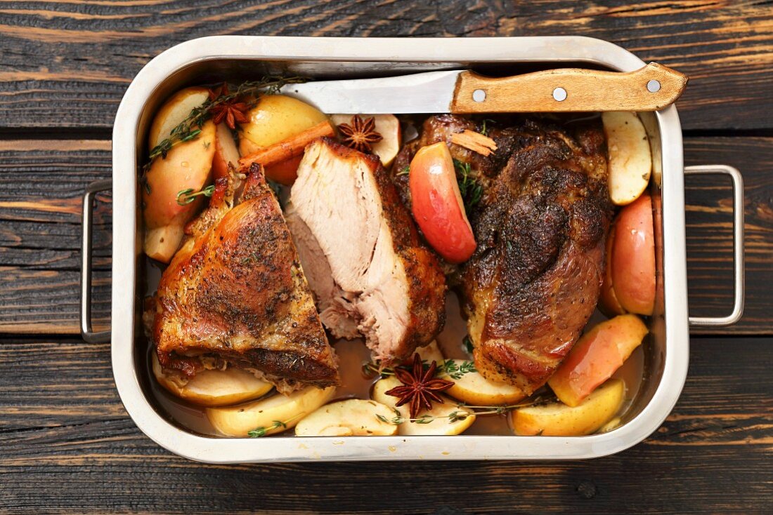 Pork shoulder baked with apples, cinnamon and star anise