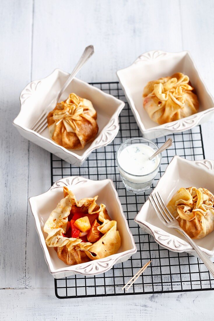 Pancake parcels with chicken, peppers and pineapple