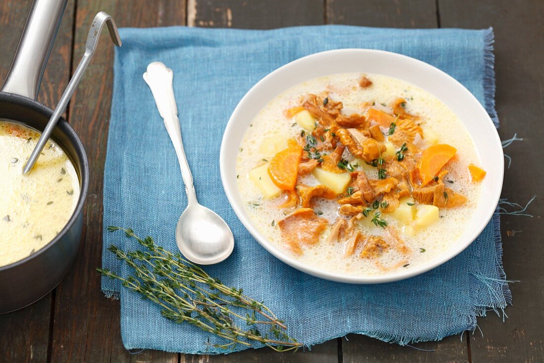 Chanterelle mushroom soup with potatoes, cream and thyme