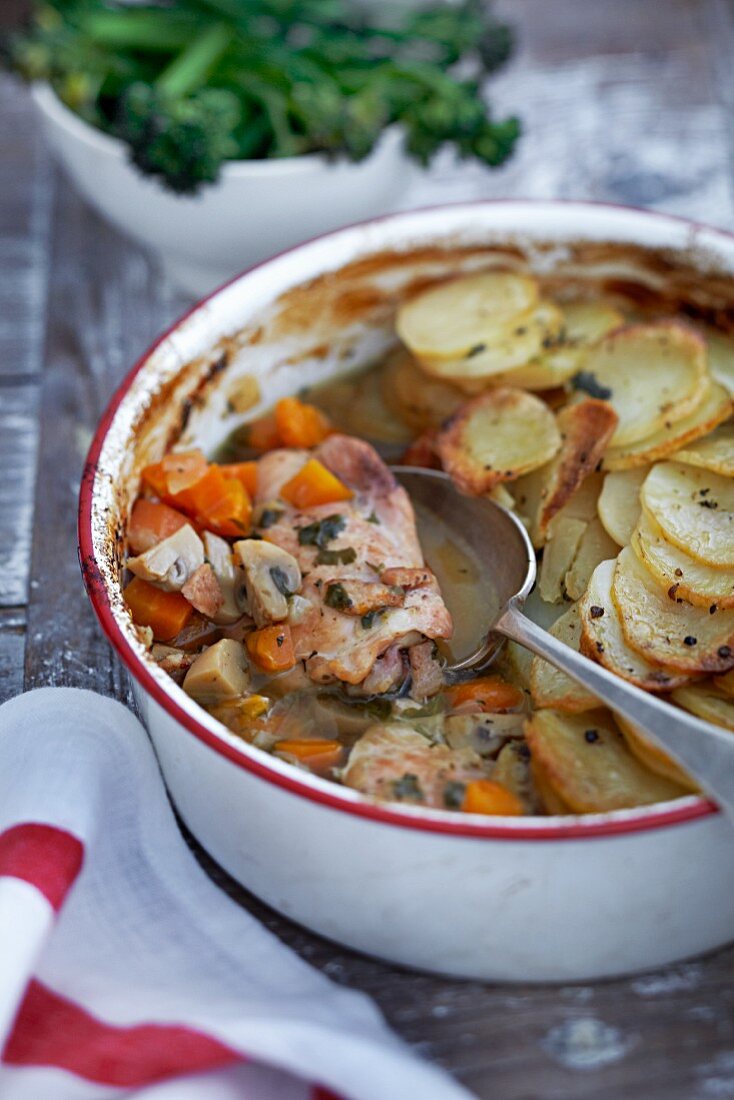 A hot pot with pork and potatoes