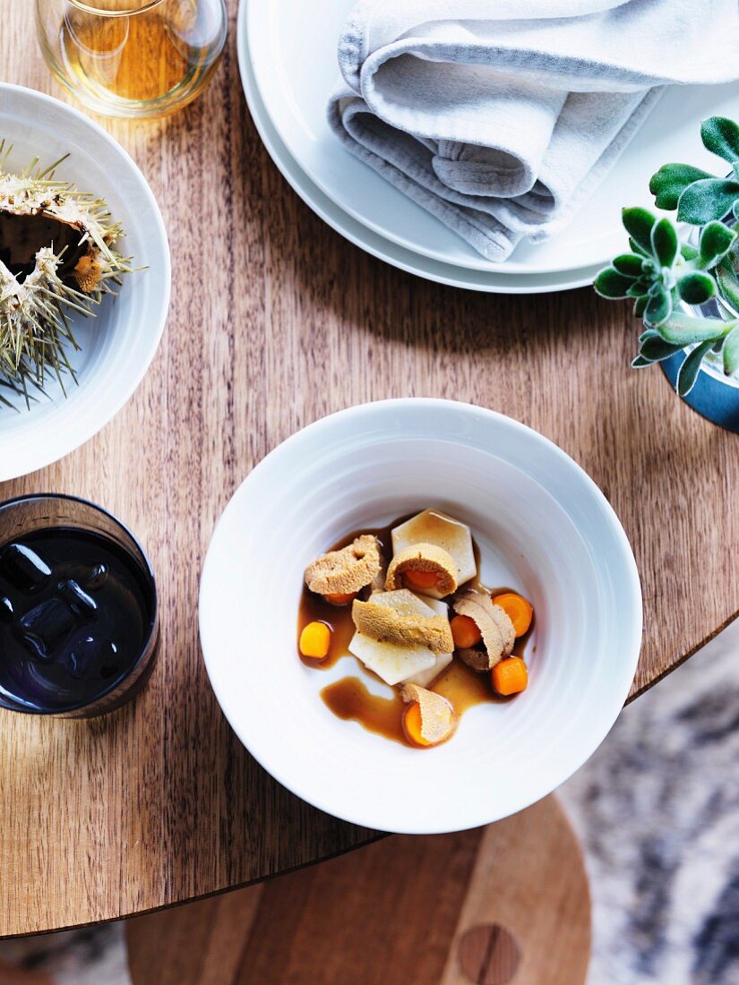 Sea urchin on dashi root vegetables