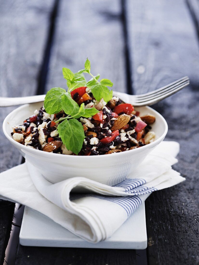 Red rice salad with feta cheese and almonds