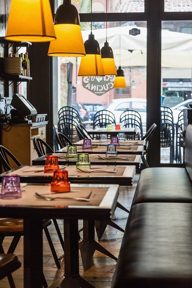 Tables and chairs in a restaurant in Rome