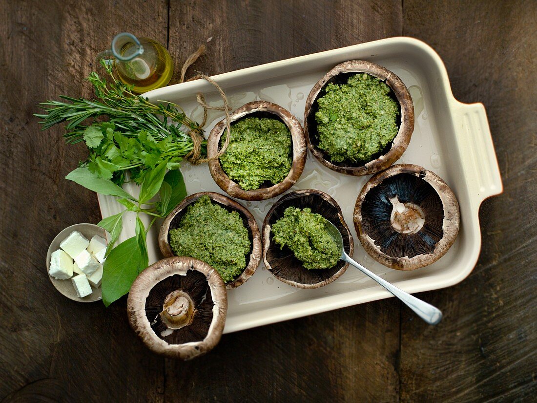 Stuffed mushrooms filled with herbs (seen from above)