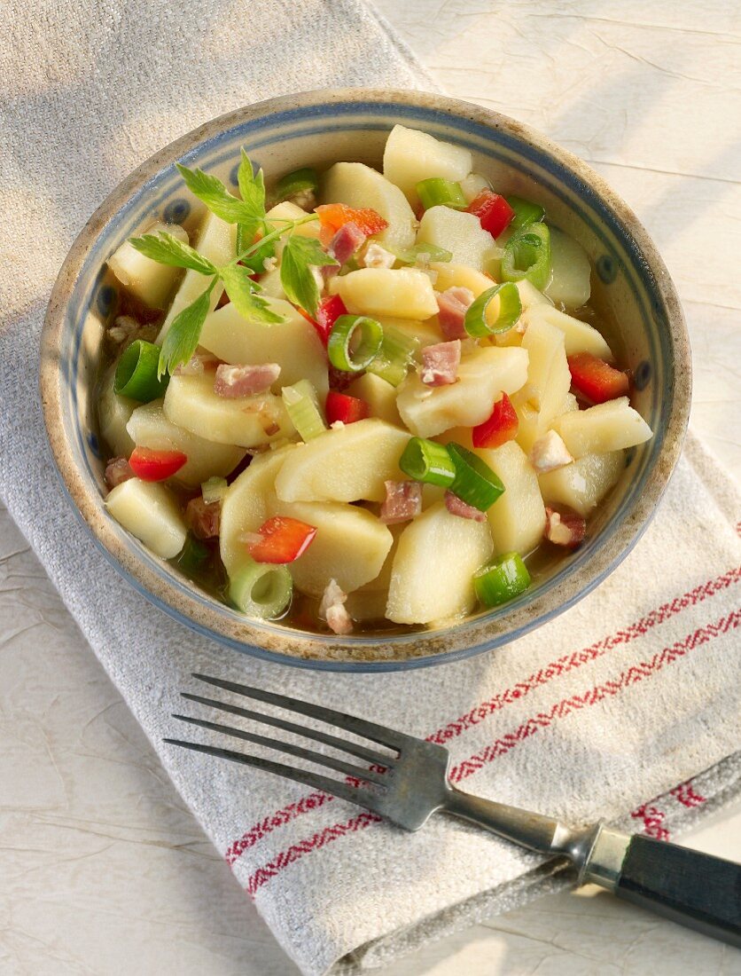 Potato salad with peppers and spring onions