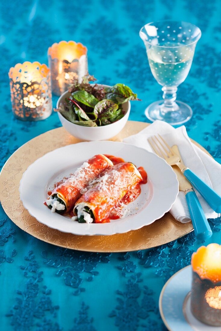 Lasagne rolls with ricotta, spinach and tomato sauce for Christmas