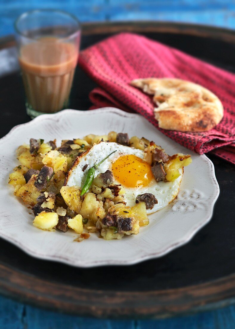 Beef with potatoes and fried egg (India)