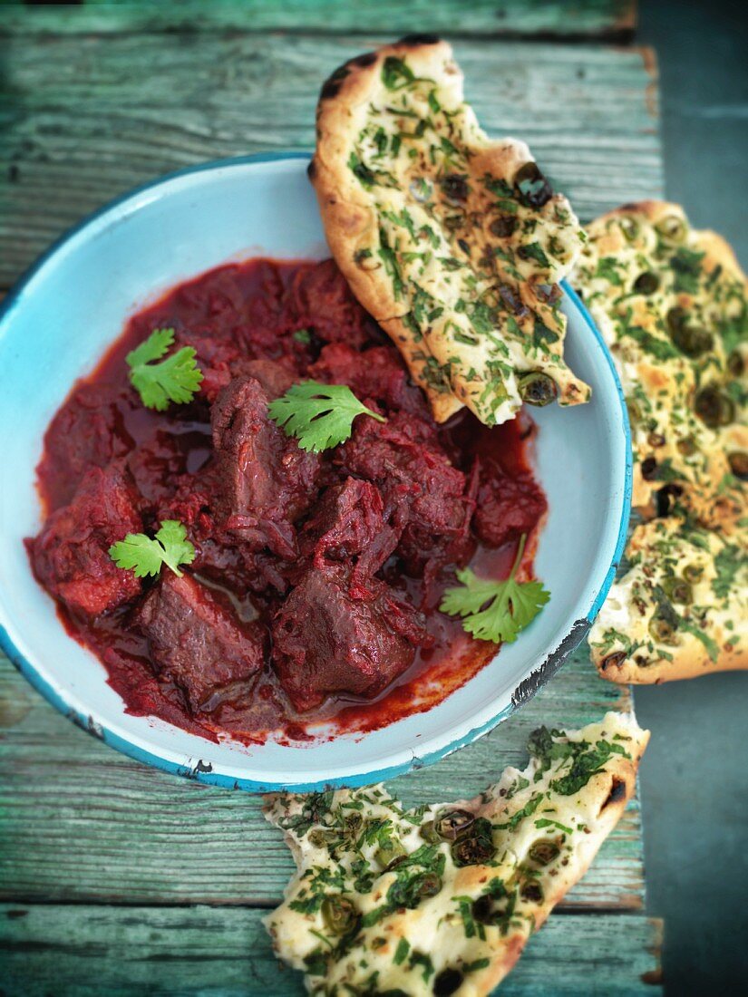 Lamb ragout with beetroot and unleavened bread