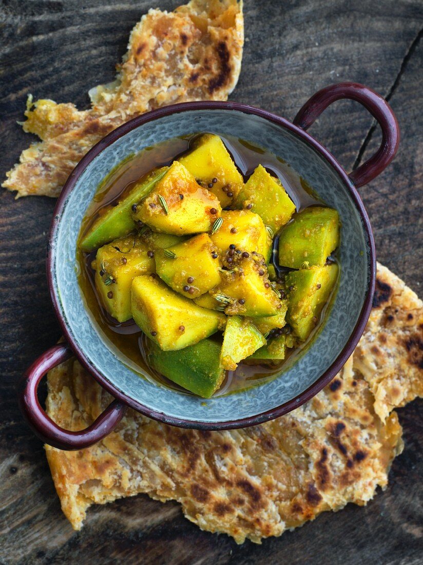 Pickled mango served with chapatis