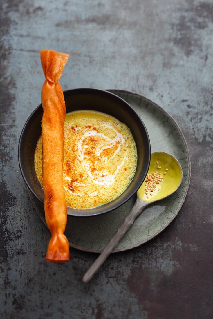 Oriental coconut and curry soup with a corn-fed chicken and pineapple roll