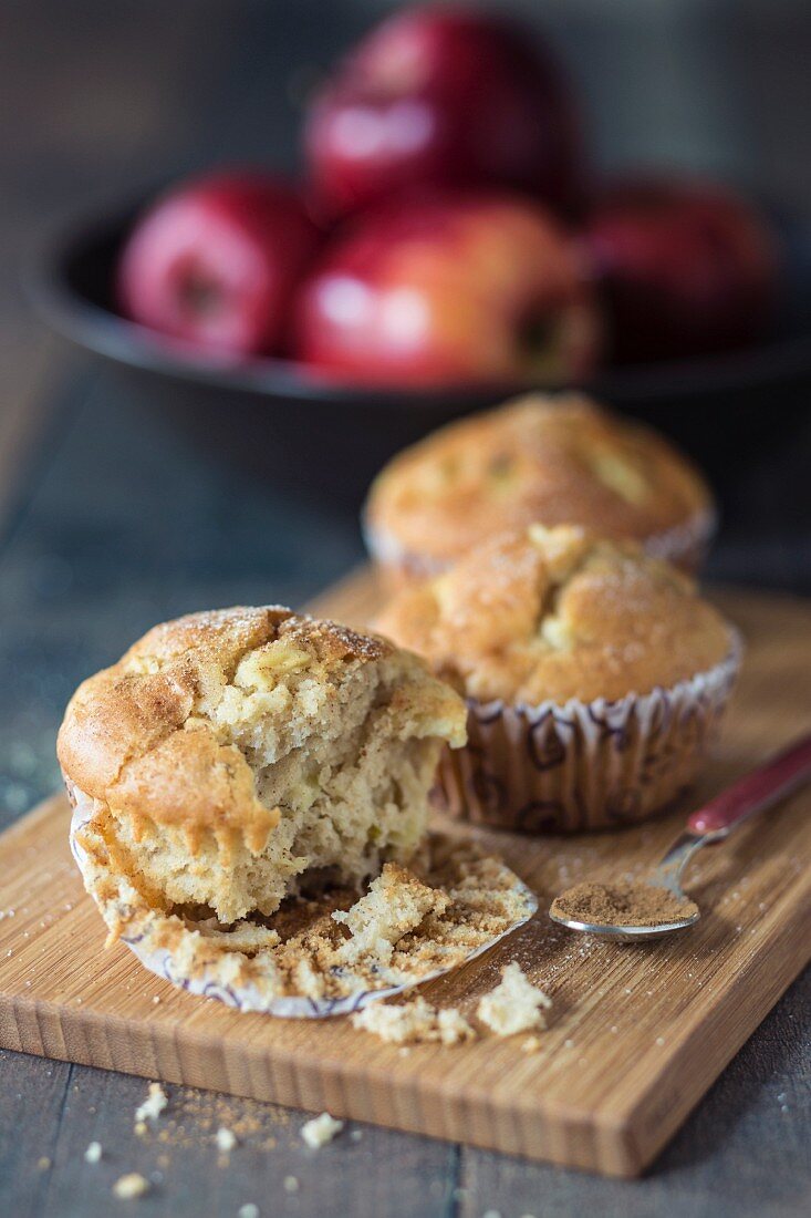 Apple and cinnamon muffins on a chopping board