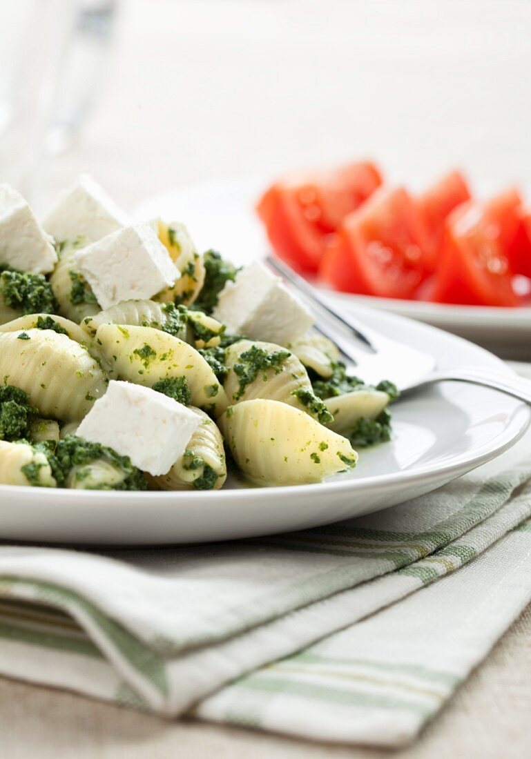Shell pasta with pesto and feta cheese