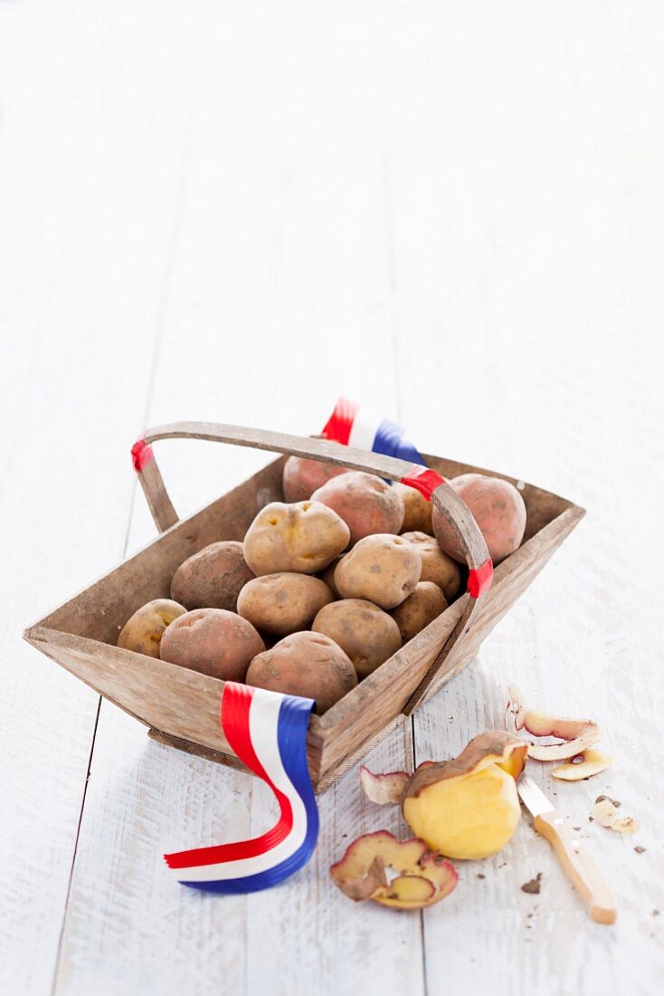 Fresh potatoes from Holland in a wooden basket