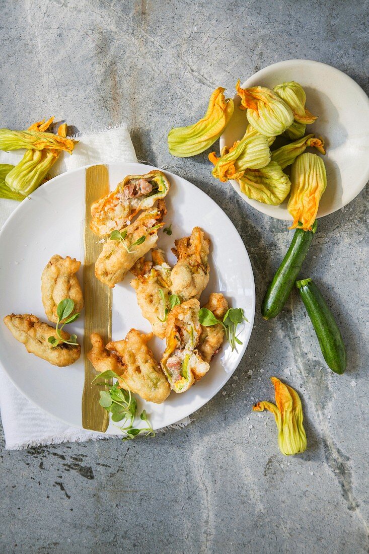 Fried courgette flowers filled with goat's cheese, bacon and sage
