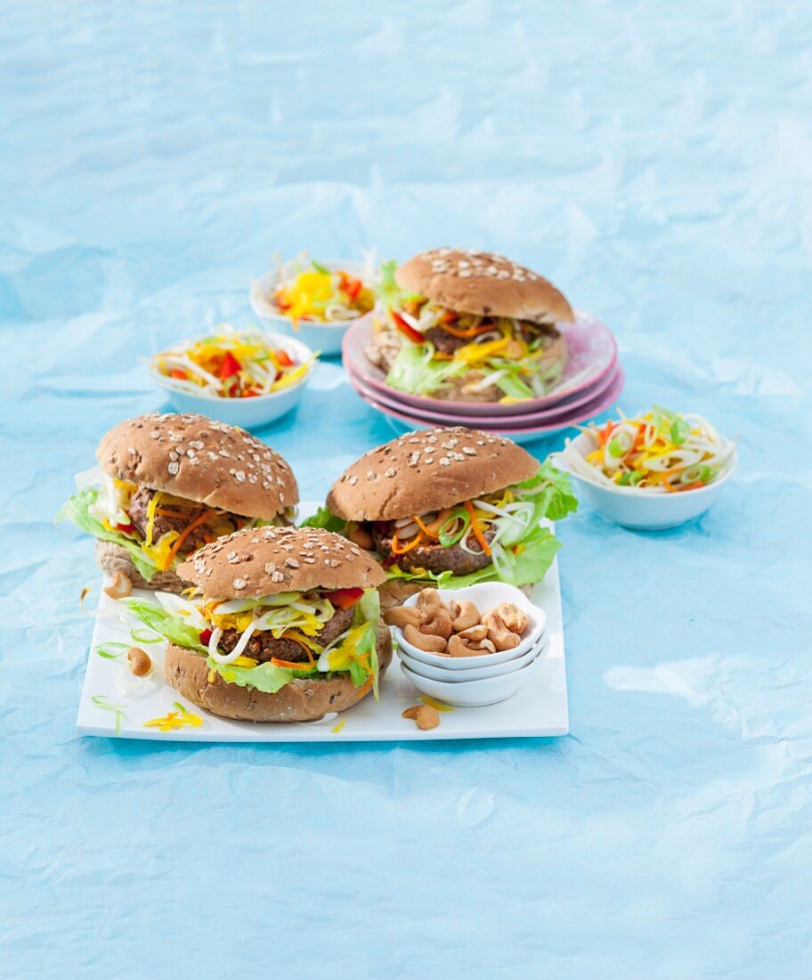 Hamburgers with spring onions, peppers and cashew nuts