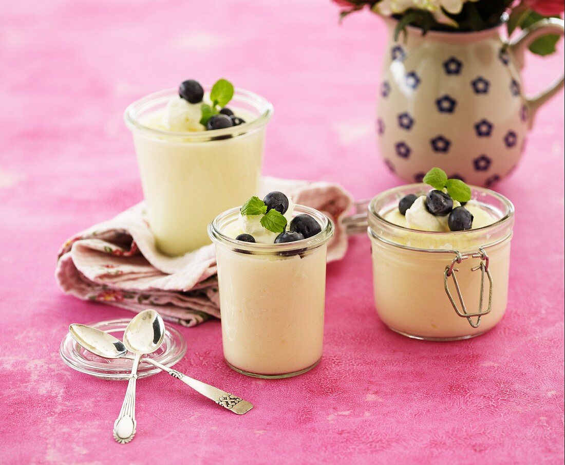 Glasses of vanilla cream with blueberries