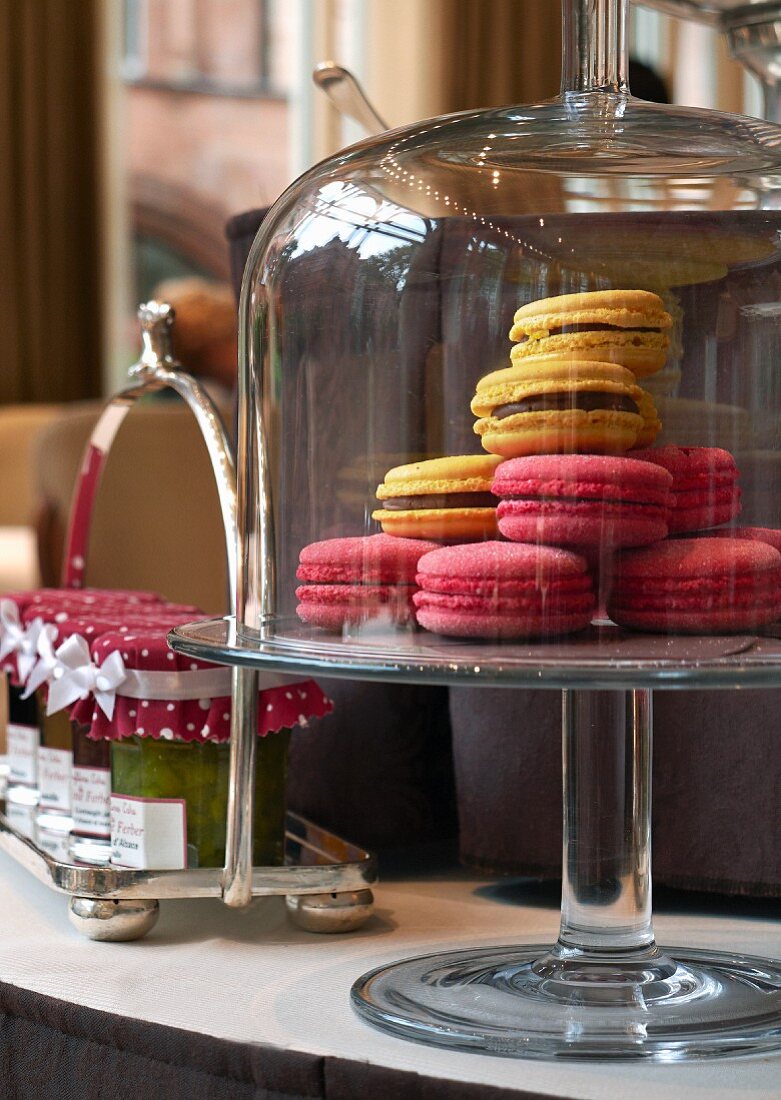 Macaroons and jars of jam in a restaurant