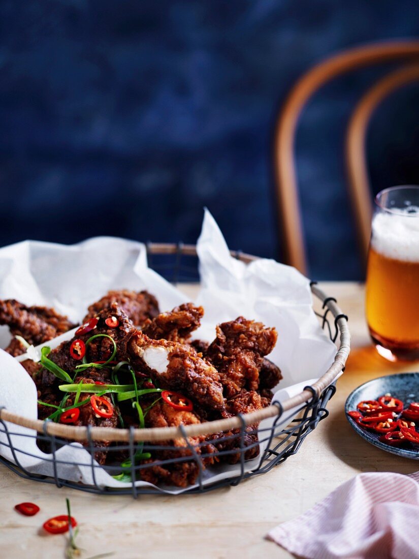 Crispy chicken pieces with spicy tamarind sauce