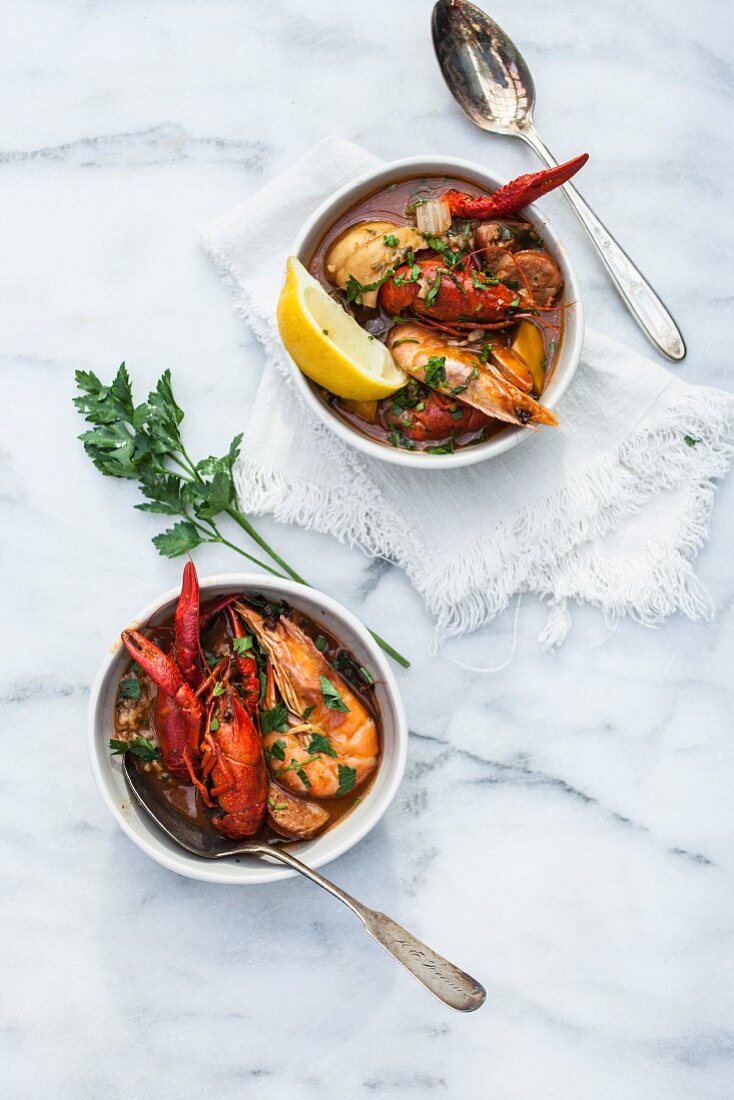 Crayfish stew with king prawns in soup bowls (Portugal)