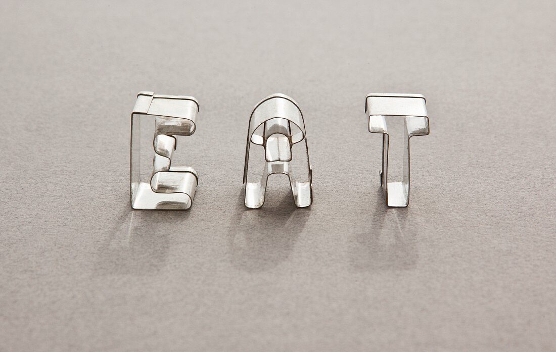 The word EAT made with letter shaped cutters