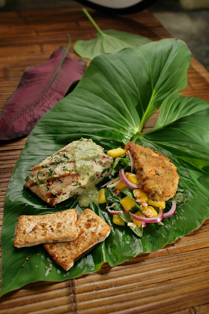 Variations of mahi fish on a banana leaf
