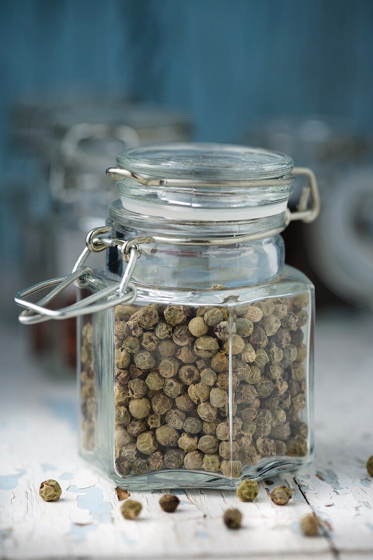 A jar of dried peppercorns