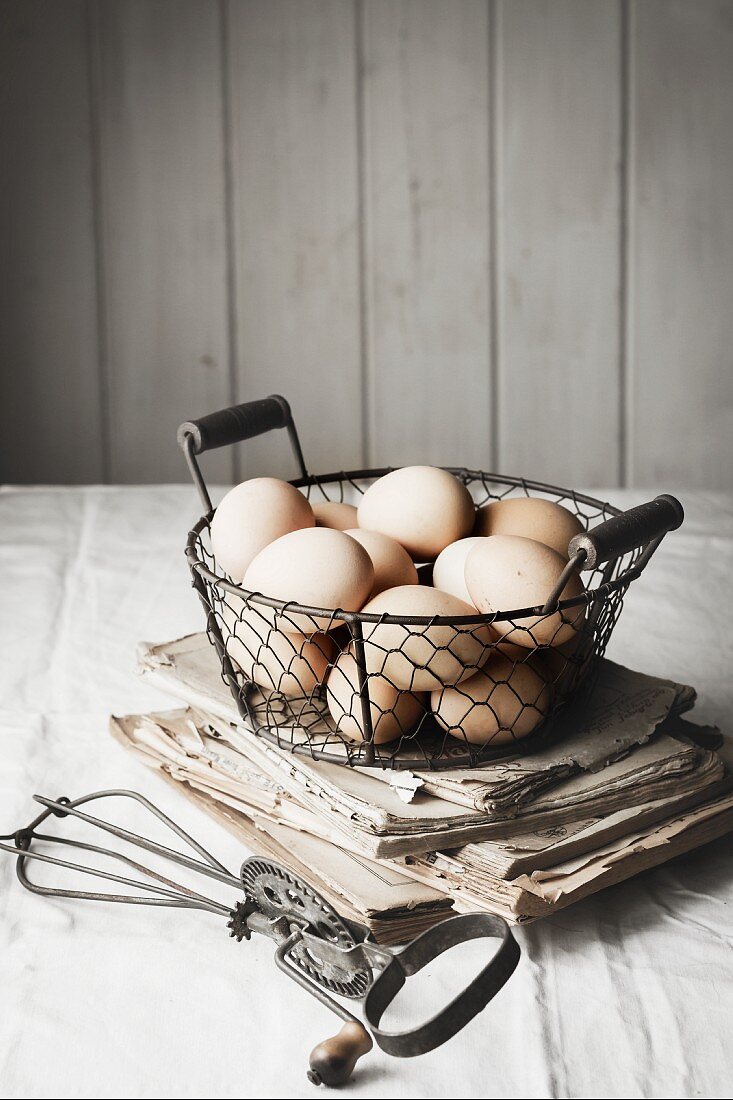 Fresh hens' eggs in wire basket