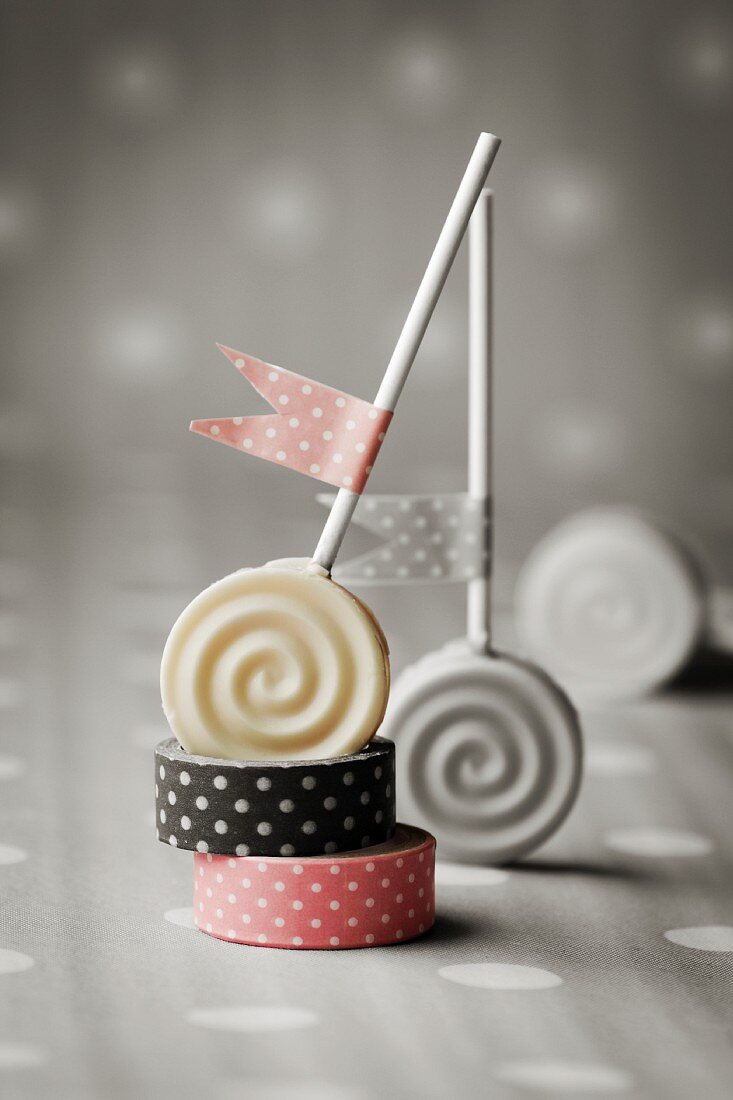 Carrot lollies decorated with polka dot flags