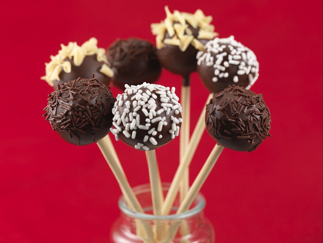 Cake pops with chocolate sprinkles and nuts