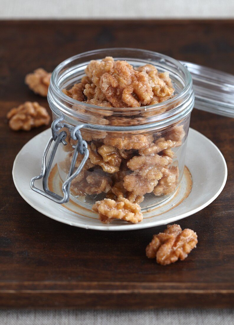 Candied walnuts in a preserving jar