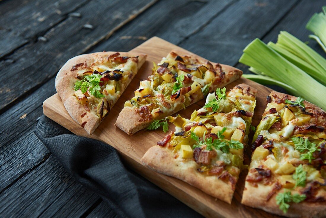 A rustic pizza with leeks, potatoes and bacon