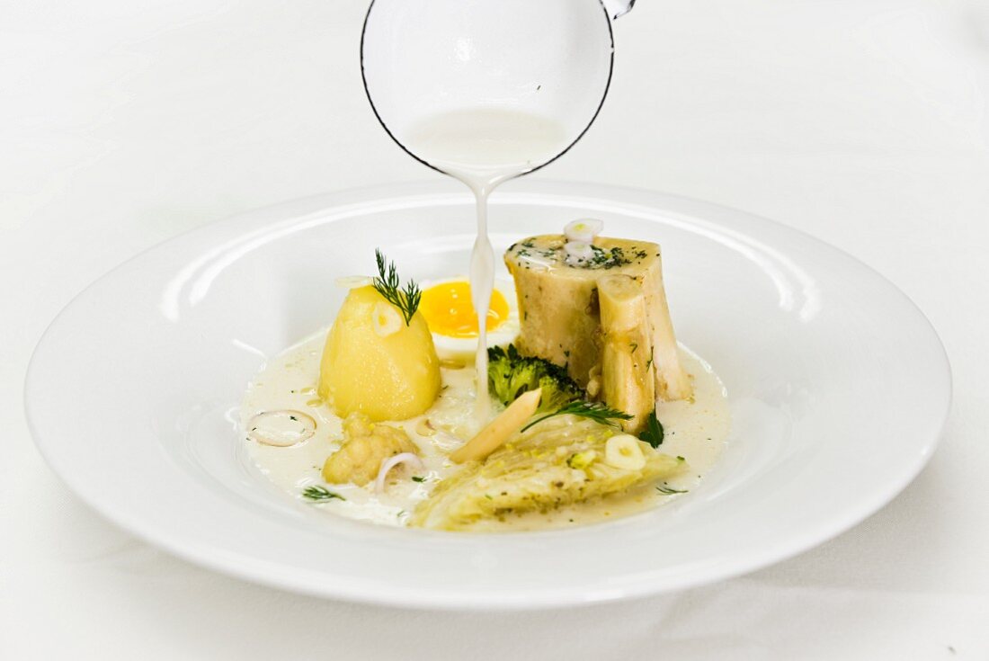 White borscht with white cabbage, potatoes and egg