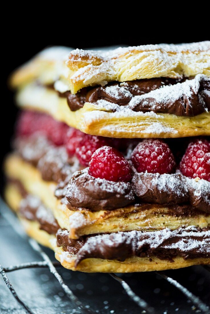 Mille feuilles with chocolate cream, raspberries and icing sugar