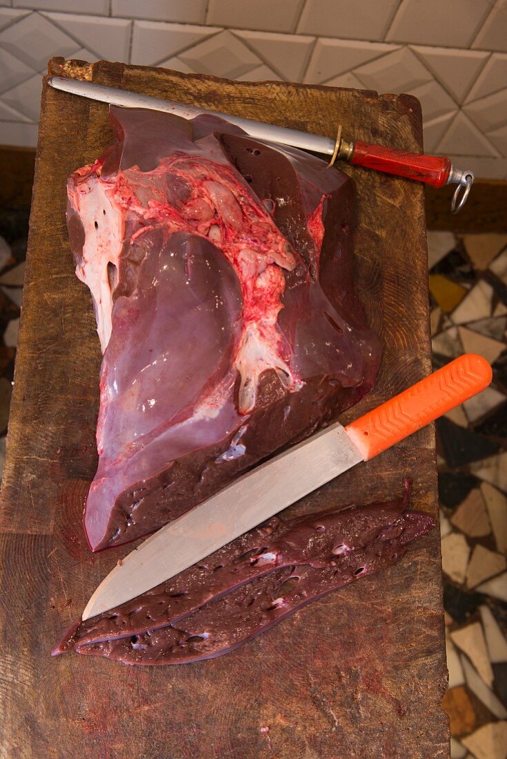 Fresh liver on a wooden board