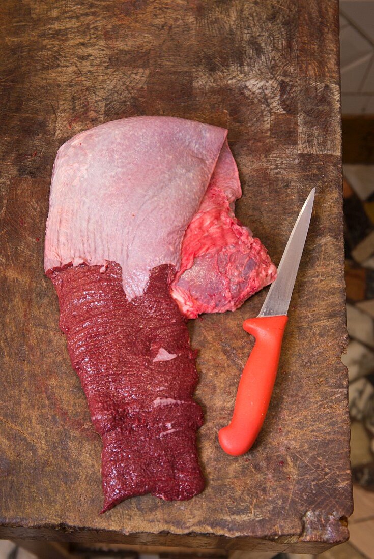 Fresh spleen on a wooden board