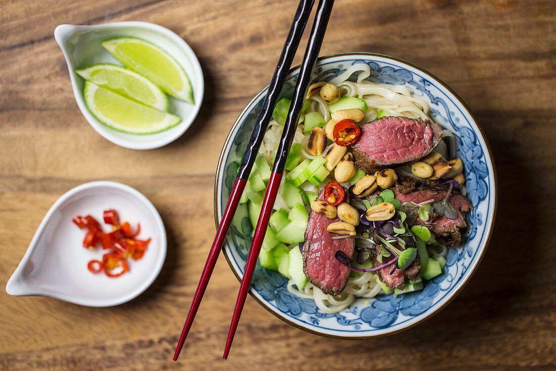 Beef salad with rice noodles, cucumber, peanuts and chillis with a lime dressing (Asia)