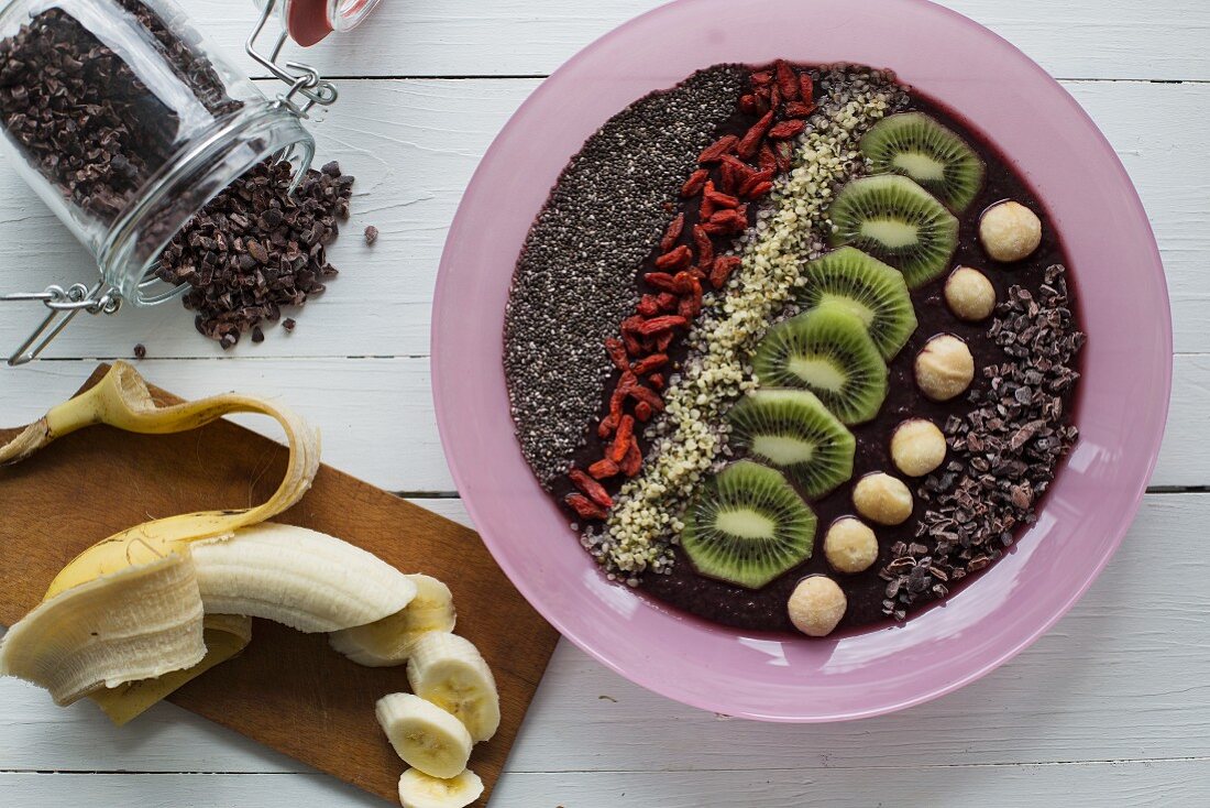 A smoothie bowl with acai berries and super foods (seen from above)