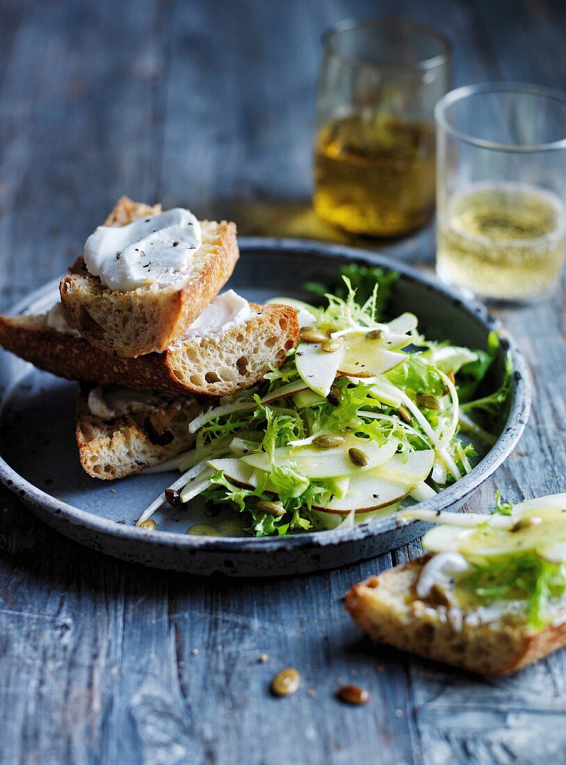 Pear, apple and frise salad with goat s cheese curd toasts