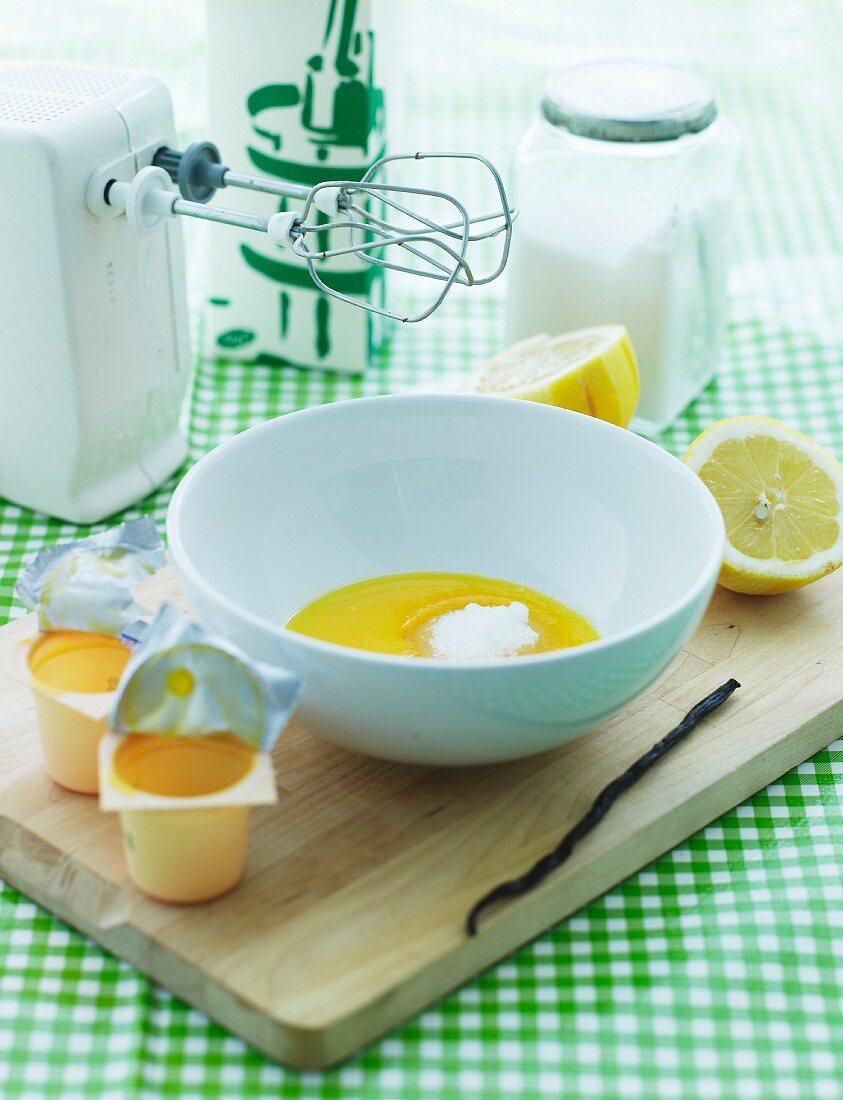 Ingredients for Danish buttermilk dessert: egg yolk, vanilla, sugar and lemons