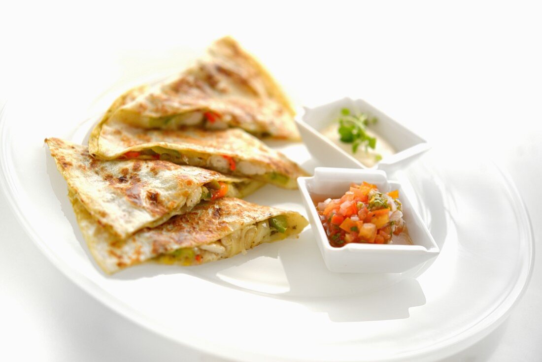 Stuffed pita bread served with hummus and tabbouleh