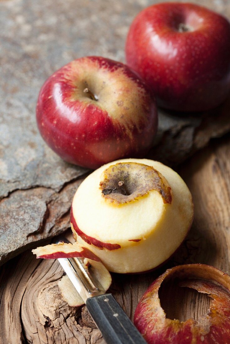 Red Renette apples, one peeled